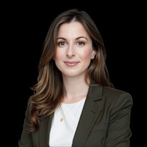 Woman in business suit against black background